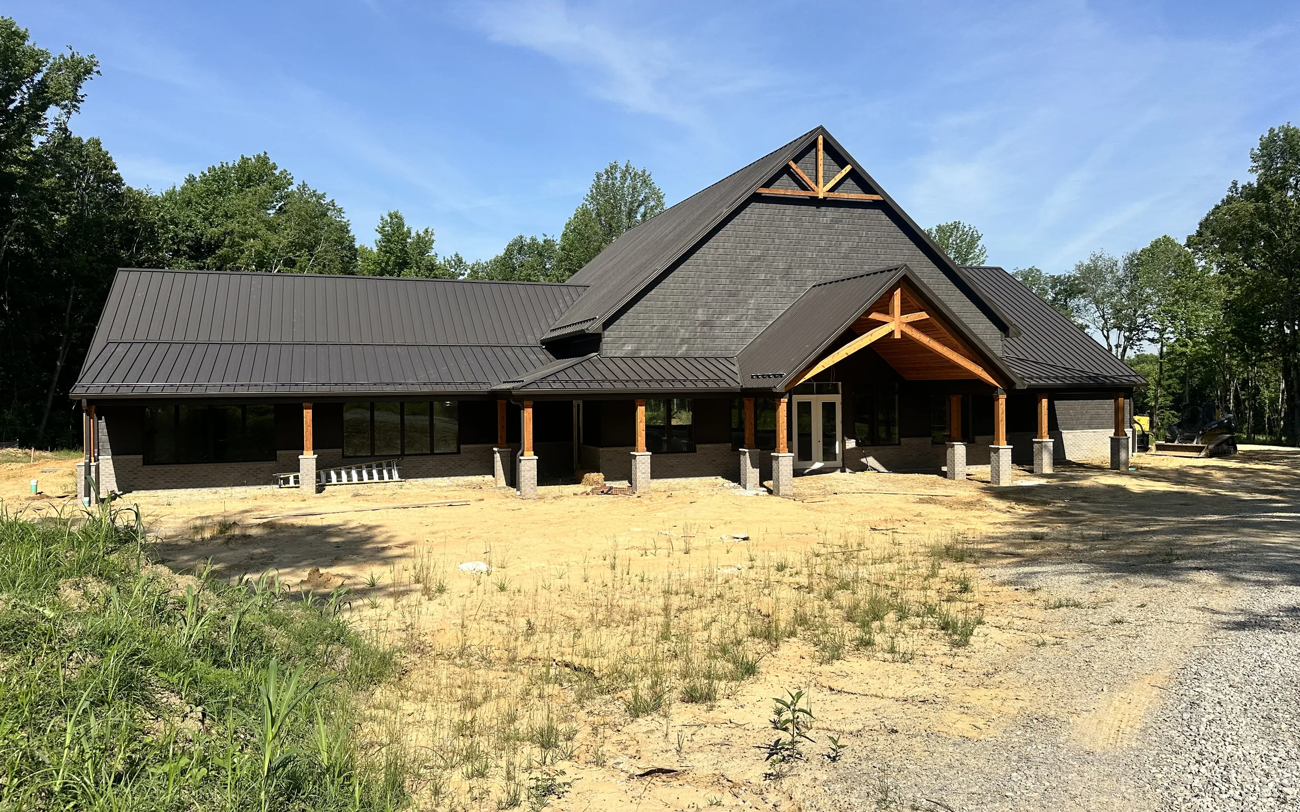 The Ronnie Brookshire Lodge standing on the grounds, summer 2026