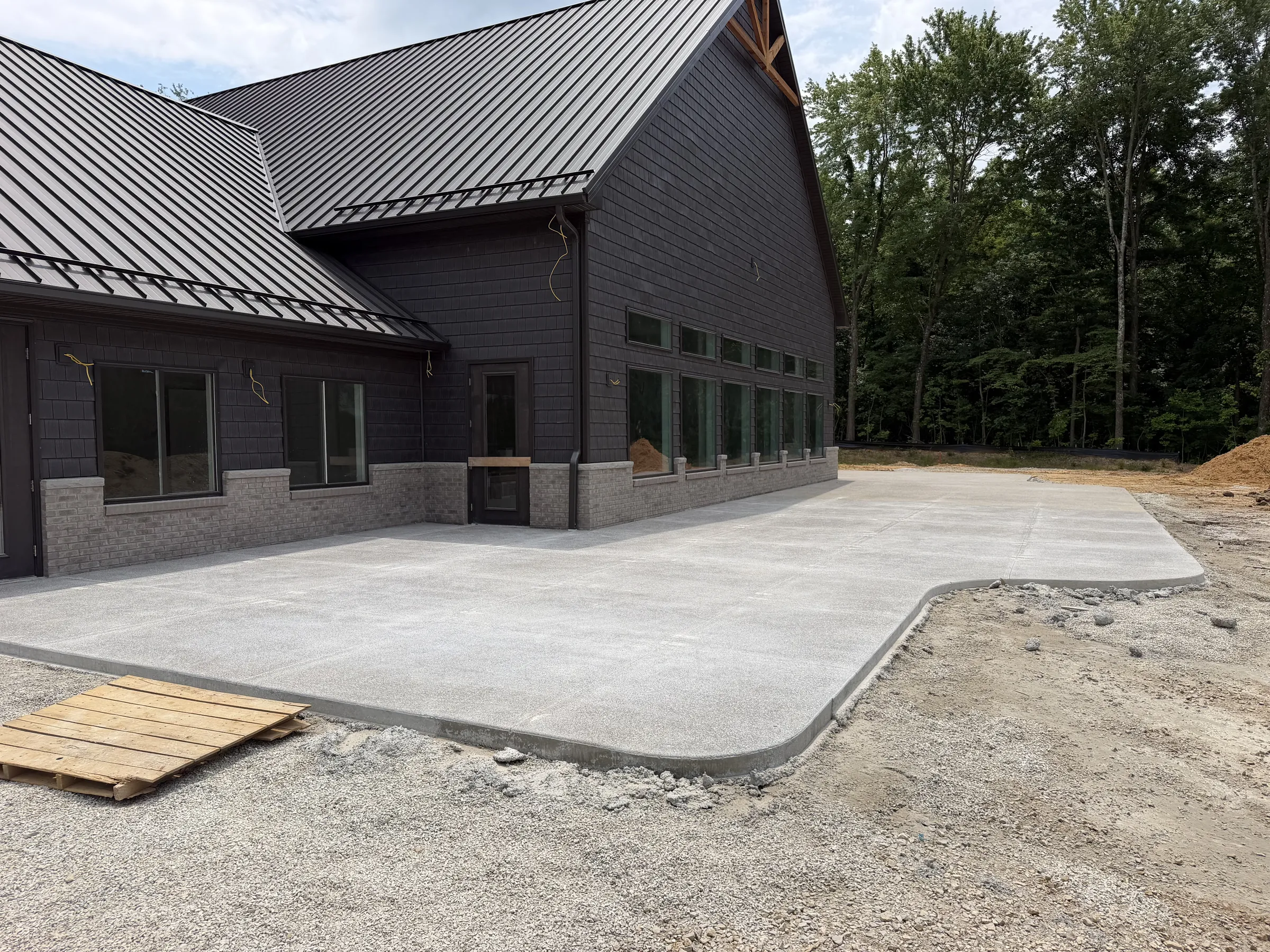 The lodge under construction, side elevation, summer 2026
