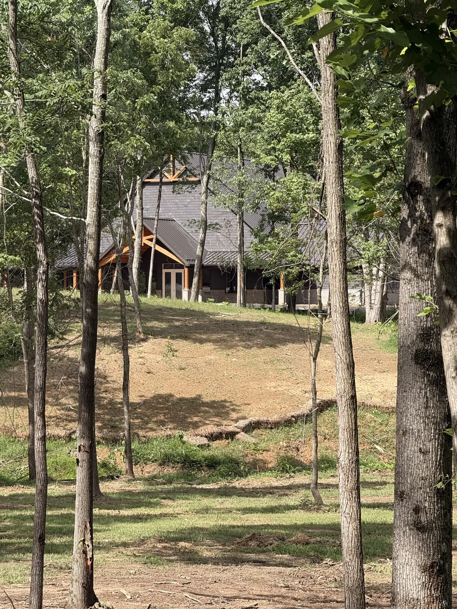 The lodge seen through the trees