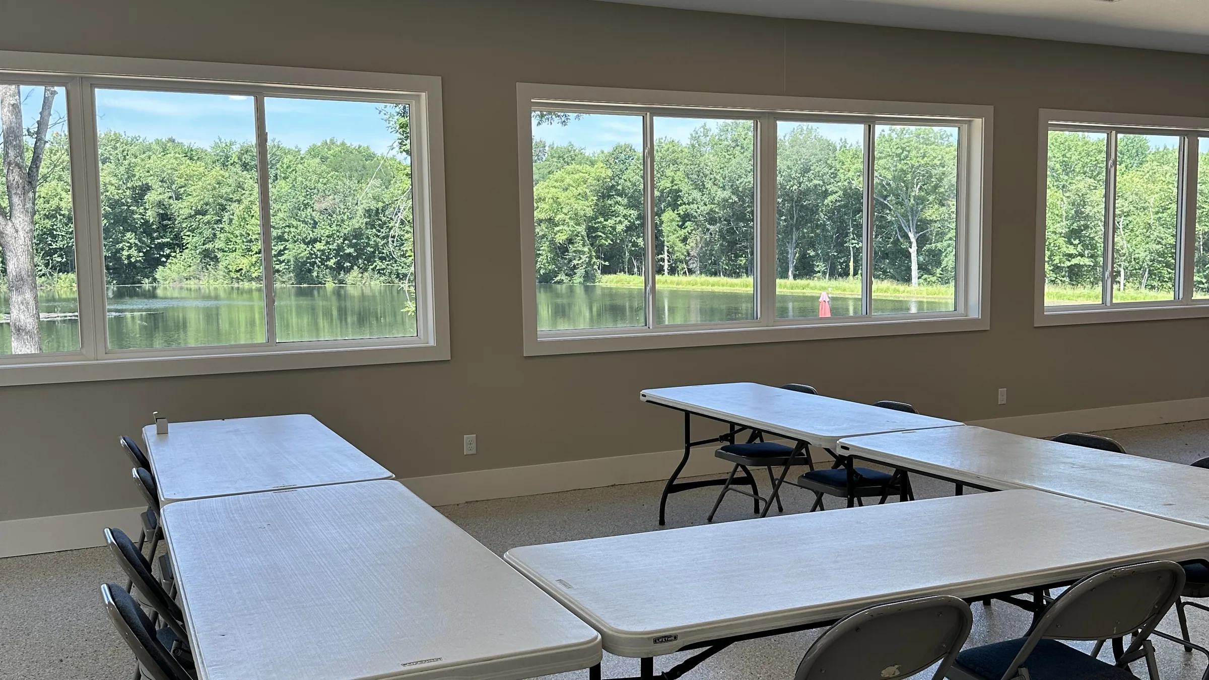 The activity center interior, windows overlooking the lake